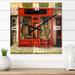 Designart 'Red Facade of Charming Shop In Paris I' French Country Metal Wall Clock