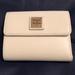 Dooney & Bourke Bags | Dooney & Bourke Trifold Wallet In Off White Nwt | Color: Cream | Size: 4.5”L X 3.75”H X 0.75”W