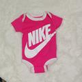 Nike One Pieces | Nike Pink Newborn Baby Short Sleeve Onesie White Swoosh Logo 0-6 Month | Color: Pink/White | Size: 0-3mb