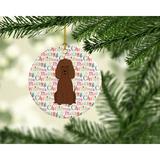 The Holiday Aisle® Merry Christmas Irish Water Spaniel Hanging Figurine Ornament /Porcelain in Blue/Brown/Pink | 2.8 H x 2.8 W x 0.15 D in | Wayfair