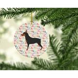 The Holiday Aisle® Miniature Pinscher Merry Christmas Hanging Figurine Ornament /Porcelain in Black/Blue/Pink | 2.8 H x 2.8 W x 0.15 D in | Wayfair