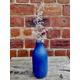 Bottle bud vase painted in layers of salt wash and chalk paint in napoleonic blue