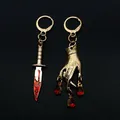 Boucles d'oreilles Red Dagger Hand The Asells Boucles d'oreilles Lady & Dagger plaquées or Boucles