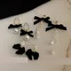 Boucles d'oreilles longues pendantes en perles noires pour femmes boucles d'oreilles mignonnes