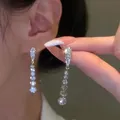 Zcomprend-Boucles d'oreilles goutte d'eau en cristal pour femme longue boucle d'oreille pompon