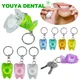 Porte-clés de fil dentaire en forme de dent fil dentaire portable clé en rouleau soins des dents