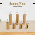Bouteille à bille roulante en bois de bambou naturel avec fenêtre bouteille à rouleau d'extraction