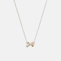 Coach Jewelry | Coach Pave Bow Pendant Necklace | Color: Gold | Size: Os