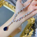 Collier de luxe avec pendentif imitation saphir goutte d'eau couleur argent avec pierre bleue