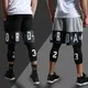 Leggings de compression de sport pour hommes pantalons assiste pantalons de survêtement leggings