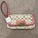 Coach Bags | Brand New Coach Larger Wristlet. | Color: Cream/Pink | Size: Os