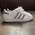 Adidas Shoes | Adidas Women Superstar - Animal Print Cloud White/Gold Metallic/Core Black | Color: Black/White | Size: 6