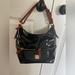 Dooney & Bourke Bags | Dooney And Bourke Handbag/Satchel. | Color: Black | Size: 12 X 9 X 5