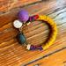 Anthropologie Jewelry | Anthropologie Bracelet | Color: Purple/Yellow | Size: Os