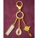 Feng Shui Import Venus Friday Sexy Love Talisman Key Chain in Yellow | 4 H x 2 W x 1 D in | Wayfair 3091