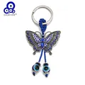 Porte-clé pendentif papillon en alliage d'oeil porte-bonheur perle d'oeil maléfique turc bleu