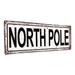 The Holiday Aisle® North Pole Christmas Metal Sign Metal | 4.25 H x 11.5 W x 0.04 D in | Wayfair DCF1E5D9FA01498F98E4D008A4D155E9