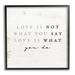 Stupell Industries Love Is What You Do Phrase Framed On Wood Graphic Art Wood in Brown/White | 12 H x 12 W x 1.5 D in | Wayfair ax-313_fr_12x12