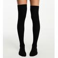 ASOS DESIGN Petite thigh high socks in black