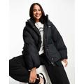 Levi's Down Bubble hooded puffer jacket in black with logo