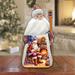 The Holiday Aisle® Santa At Fireplace Santa Wood Carved Figurine By G. Debrekht Wood in Blue/Brown/Red | 7.5 H x 4 W x 4 D in | Wayfair