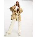 Levi's Down Bubble mid length hooded puffer jacket in cream with logo-White