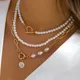 Elegante collana multistrato di perle Perline minimaliste Collana girocollo color oro per gioielli per ragazze Regali di nozze per le vacanze di tendenza