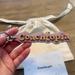 Coach Accessories | Coach Coachtopia Leather Signature Keychain Fob Bag Charm | Color: Pink/Yellow | Size: Measures: 6" (L) X 1" (H)