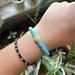 Urban Outfitters Jewelry | Blue Flat Clay Beaded Bracelet With Yellow Smiley Face Bead | Color: Blue/Yellow | Size: Os