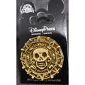 Disney Jewelry | Disney Trading Pin 00085 Pirates Of The Caribbean Aztec Skull Golden Coin Potc | Color: Gold/Red | Size: Os