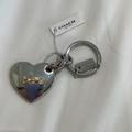 Coach Accessories | Coach - Horse & Carriage Heart Bag Charm (Nwt) | Color: Gold/Silver | Size: Os