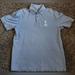 Disney Shirts | Downtown Disney Rainforest Cafe Light Blue Cotton Polo Shirt L | Color: Blue | Size: L