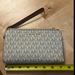 Michael Kors Bags | Michael Kors Clutch Wallet Nwot | Color: Cream/Tan | Size: Os