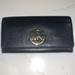 Michael Kors Bags | Euc Michael Kors Fulton Black Pebble Leather Carryall Wallet | Color: Black | Size: Os
