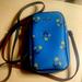 Coach Bags | Like New North South Zip Iphone Crossbody Blue With .Floral Bow Print | Color: Blue | Size: Os