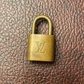 Louis Vuitton Jewelry | Authentic Bronze Louis Vuitton Lock | Color: Gold | Size: Os