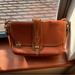 Dooney & Bourke Bags | Euc Dooney & Bourke All Weather Leather Bag In Tan/Tan With Brass Hardware. | Color: Gold/Tan | Size: Os