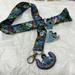 Disney Jewelry | Disney Lilo & Stitch Lanyard, Stitch And Scrump, With Two Stitch Pins | Color: Black/Blue | Size: Os