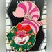 Disney Jewelry | Disney Dsf - Dssh - Christmas Tree Collection Cheshire Cat W/ Wreath Pin Le 300 | Color: Pink | Size: Os