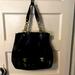 Coach Bags | Large Coach Blk Leather Purse W/ Embossed Gold Accents And Fittings | Color: Black/Gold | Size: 13”L, 12” W