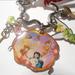 Disney Jewelry | Collectible Disney Tinkerbell And Peter Pan Purse Charm Or Key Chain With Clasp | Color: Green | Size: Os