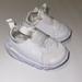 Nike Shoes | Nike White Slip On Shoes 4c Baby | Color: White | Size: 4 C