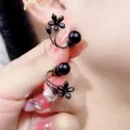 Boucles d'oreilles à tige fleur noire coréenne pour femmes boucles d'oreilles en queue de poisson