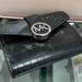 Michael Kors Bags | Michael Kors Carmen Medium Logo And Faux Leather Wallet Black Nwt | Color: Black/Silver | Size: Medium
