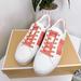 Michael Kors Shoes | Michael Kors Poppy Sneaker Shoes | Color: Orange/White | Size: Various