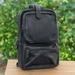 Journey at Night,'Travel-Friendly Black Leather Cross-Body Backpack'