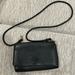 Tory Burch Bags | Like New Tory Burch Crossbody. 5 1/2- 8 1/2” | Color: Black | Size: Os