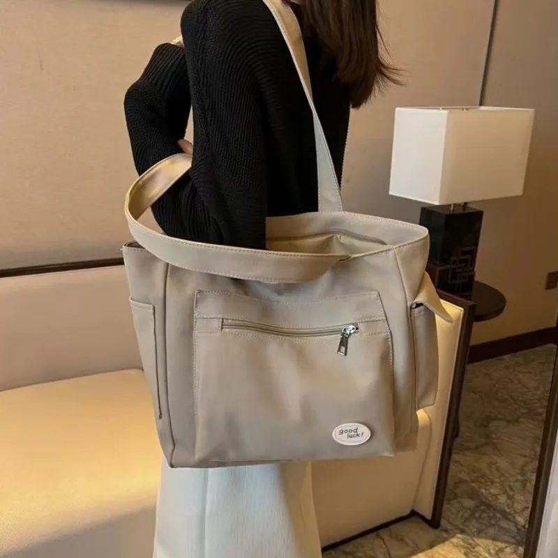 2025 mode sac à bandoulière pour femmes classe grande capacité étudiant fourre-tout nouveau toile sac à main de banlieue femmes sac Eco sac