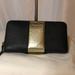 Kate Spade Bags | Kate Spade Black And Gold Cedar Street Racing Stripe Wallet. | Color: Black/Gold | Size: Os