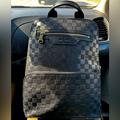 Louis Vuitton Bags | Black Lv Backpack Only Used Once It Was And Christmas Gift Price Is Negotiable | Color: Black | Size: Os